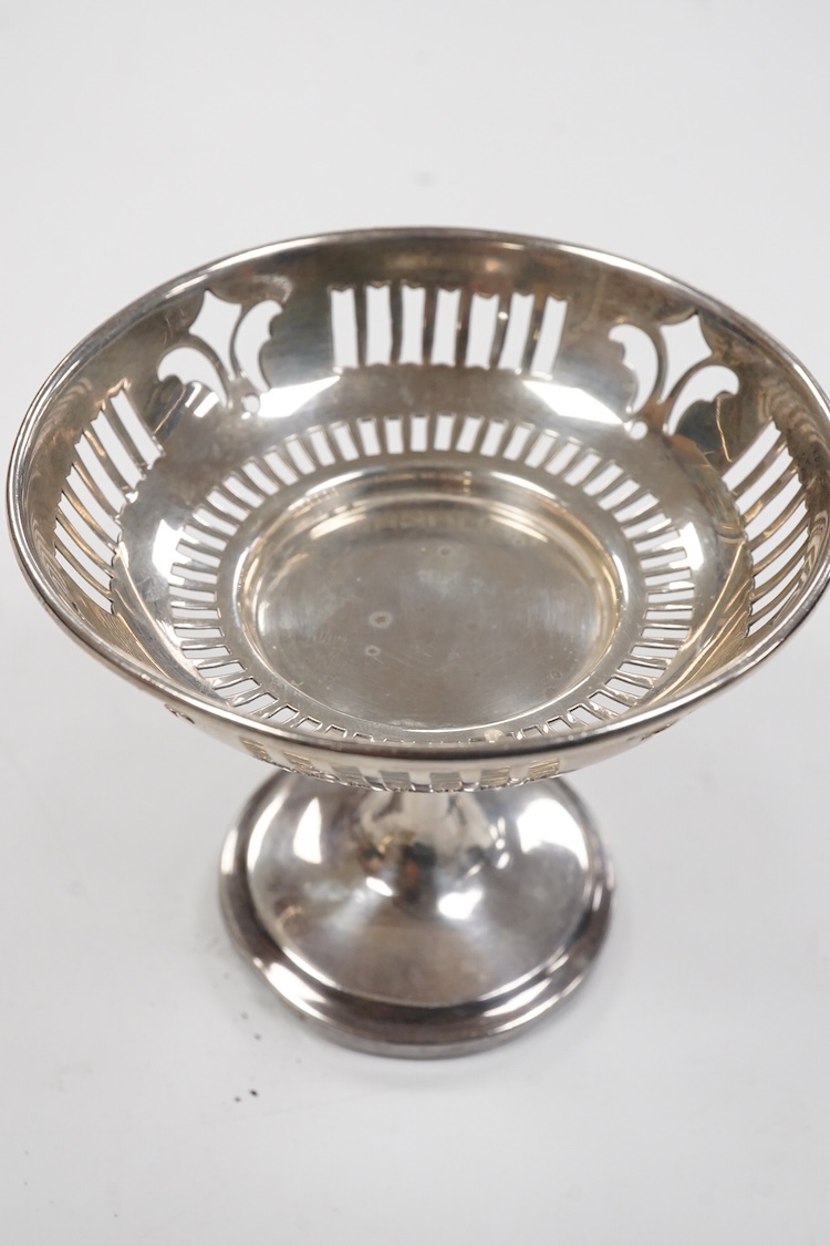 A small group of silver including an Edwardian miniature model of a throne by Edward Foligne Braham, Birmingham, 1901, 50mm, a small comport, one part of a belt buckle and three commemorative spoons, together with a gilt